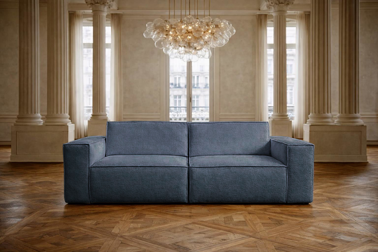 Canapé droit Beaux Arts de Paname Avenue dans un salon haussmannien  luxueux avec lustre monumental