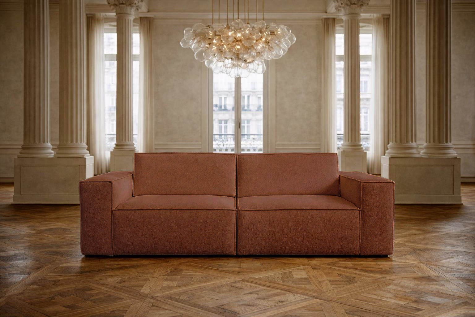 Canapé droit Beaux Arts de Paname Avenue dans un salon haussmannien  luxueux avec lustre monumental