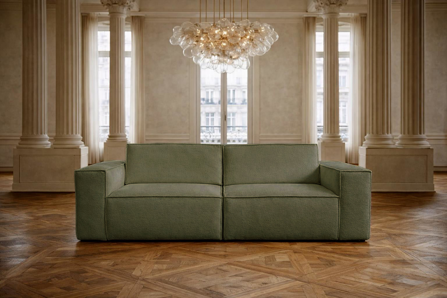 Canapé droit Beaux Arts de Paname Avenue dans un salon haussmannien  luxueux avec lustre monumental