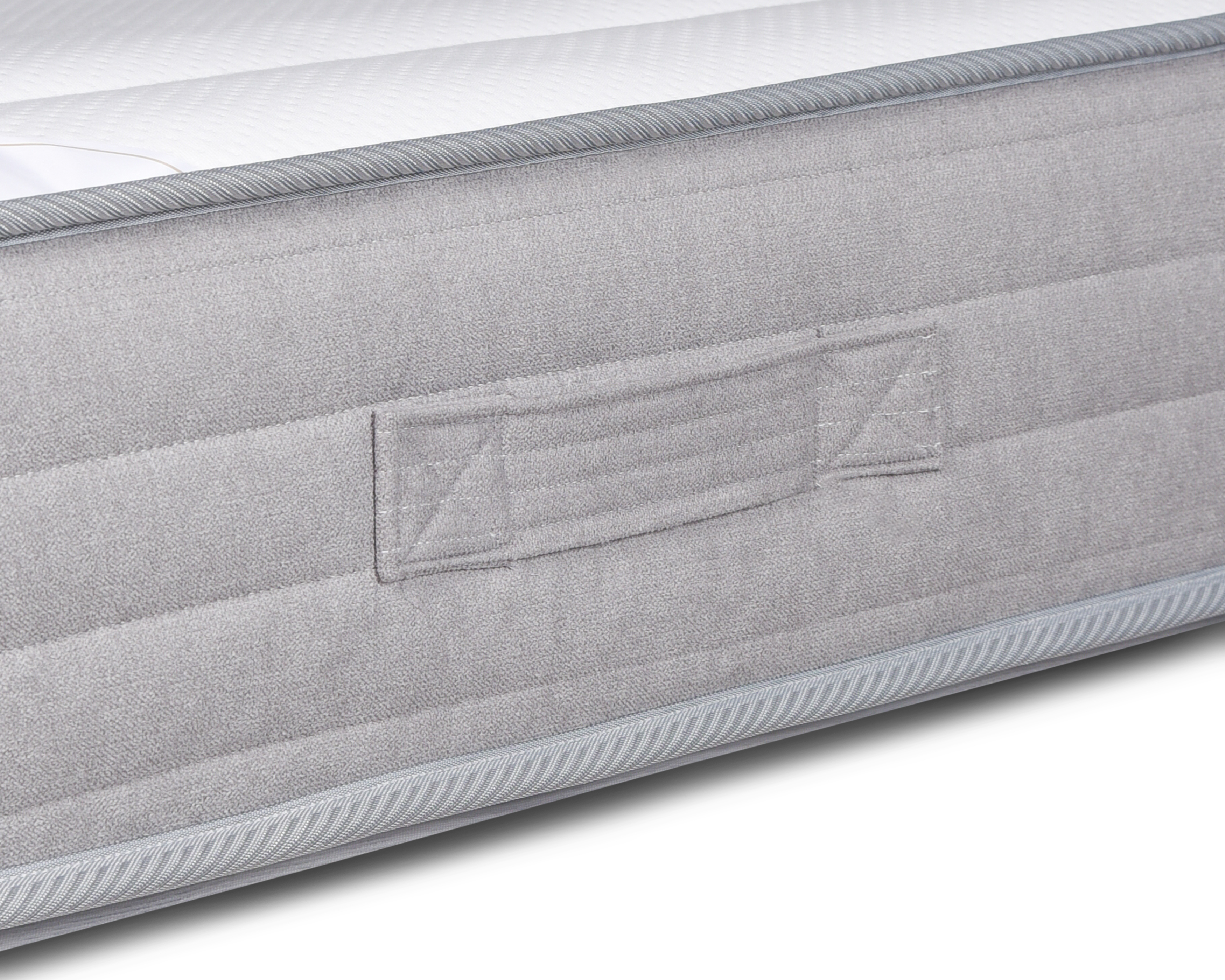 Détail poignée latérale du matelas Rollin mousse premium 35 kg/m³ 180x200 cm confort moelleux sur fond blanc