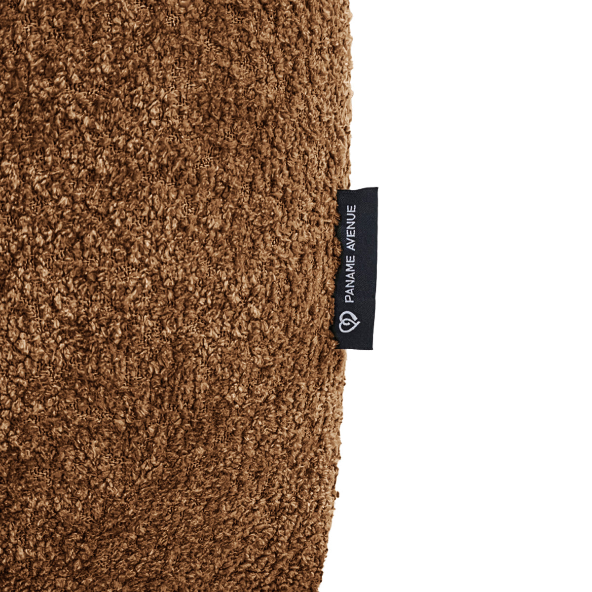 Pouf Taylor en tissu bouclette terracotta Paname Avenue, détail du label de la marque